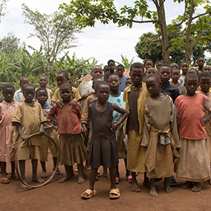 group-of-children-gathering-with-curiosity-in-a-ru-KRAARN2