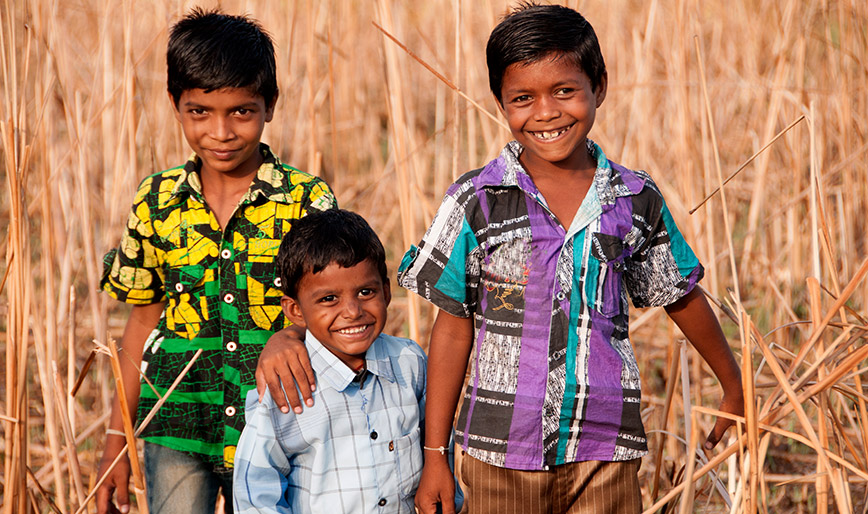 rural-boy-enjoying-together-in-the-field-india-75C349Y