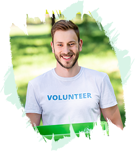 smiling-male-volunteer-holding-recycling-box-with--5JWMR2J